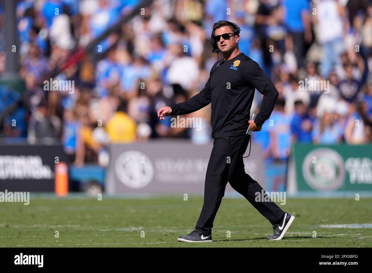 UCLA head coach Bob Chesney walks the field during a timeout during the ...