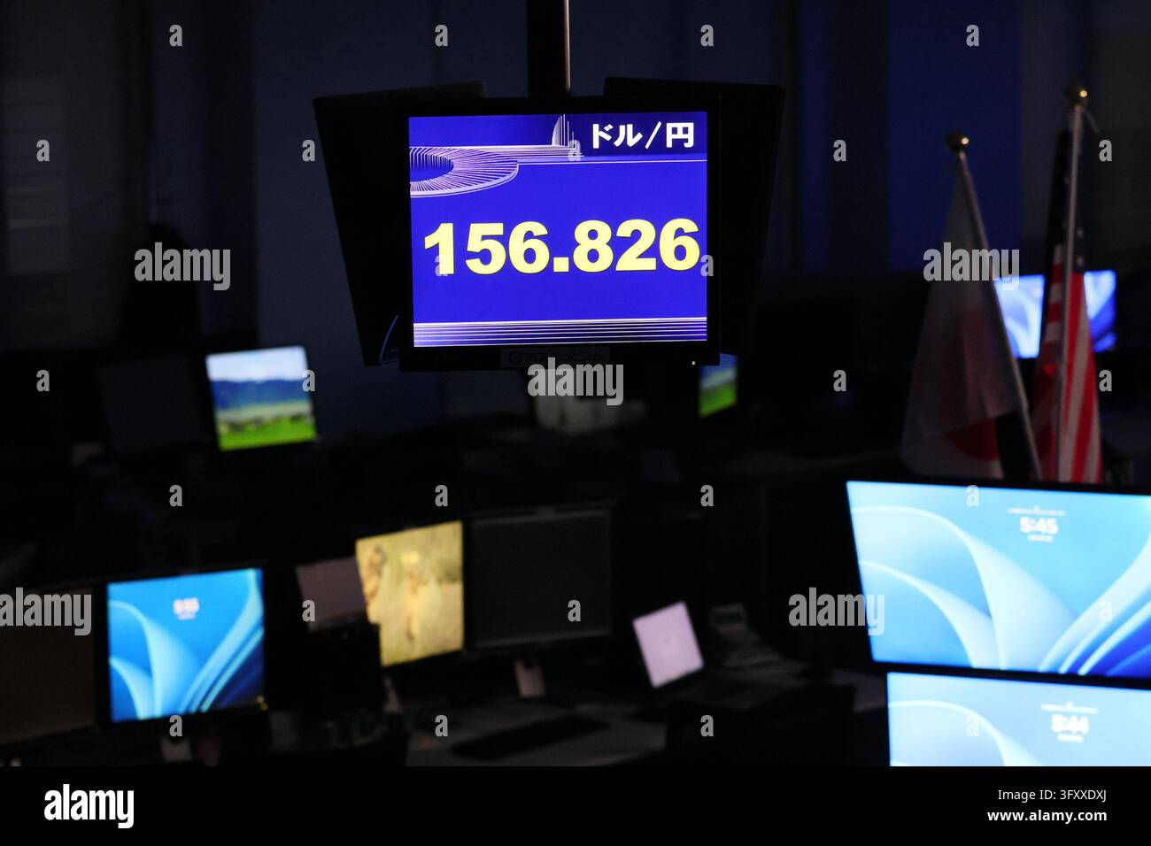 An electronic board displays the Japanese yen's exchange rate against ...