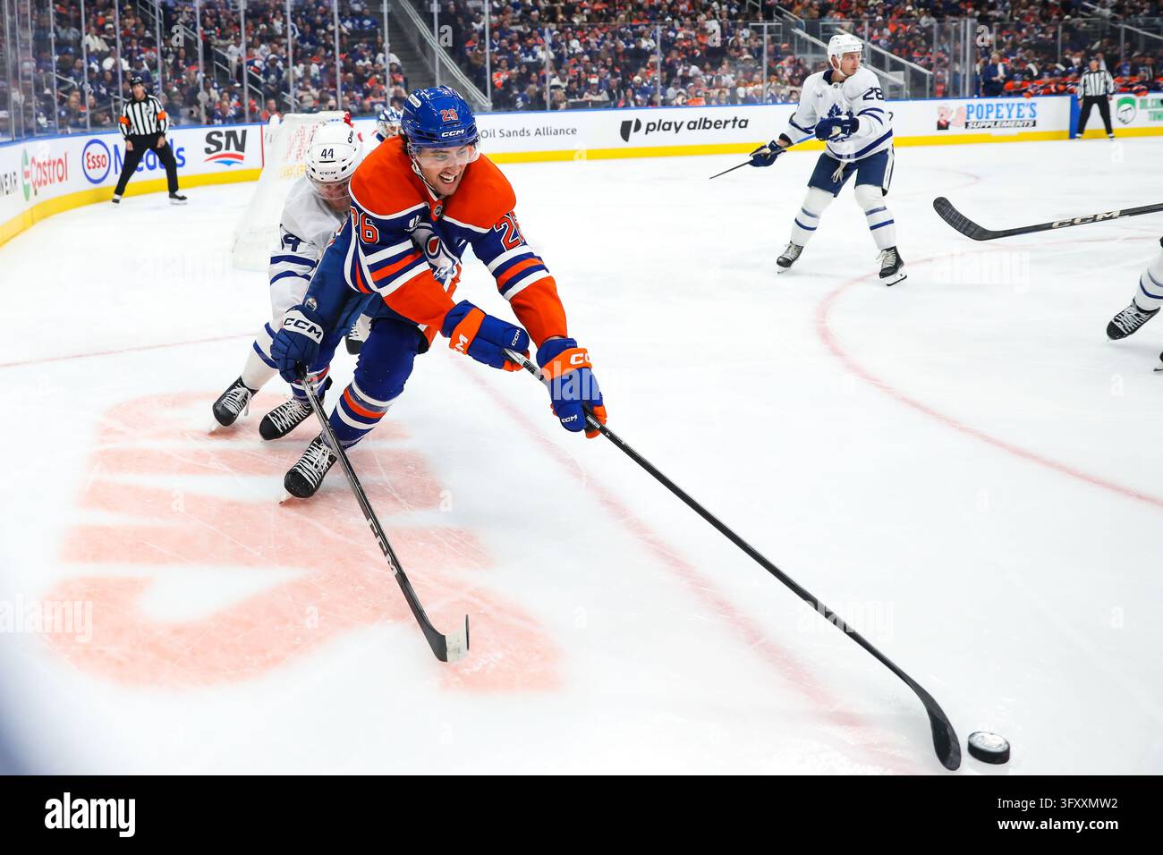 Edmonton Oilers' Alex Formenton (26) protects the puck from Toronto ...