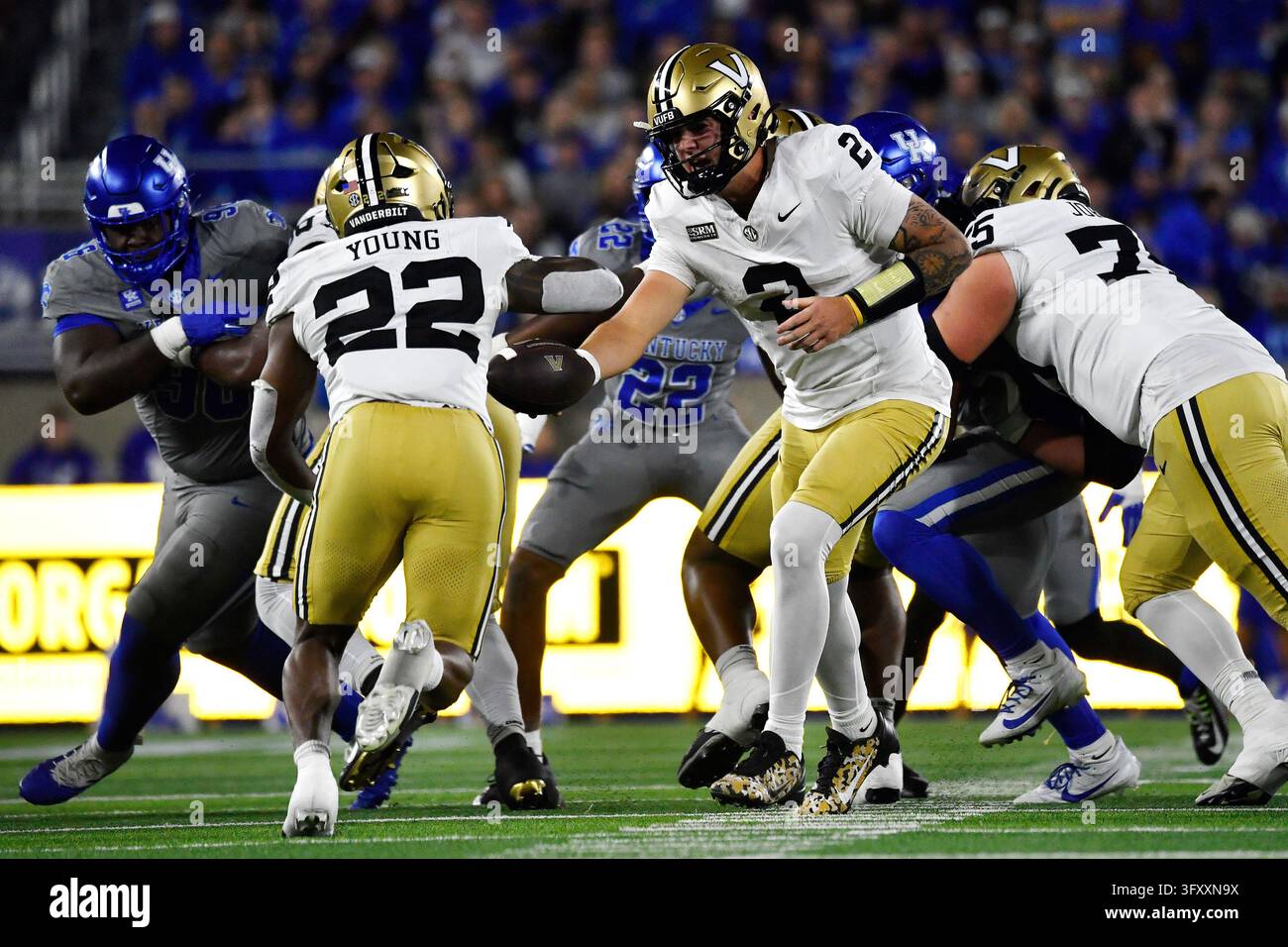 Vanderbilt quarterback Jared Curtis (2) hands the ball off to running ...