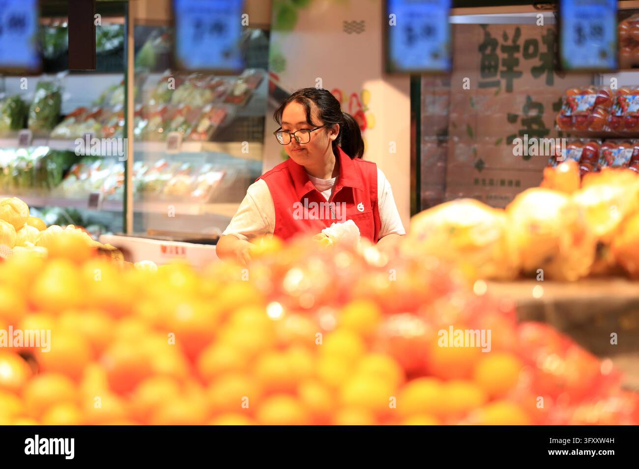 A shopper browses goods at a supermarket in Huai'an, east China's ...