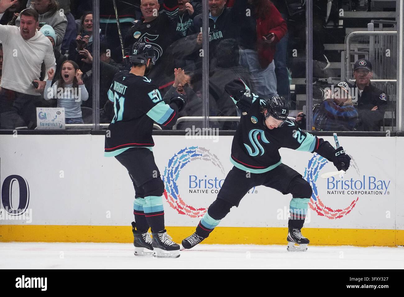 Seattle Kraken center Berkly Catton, right, celebrates scoring a goal ...