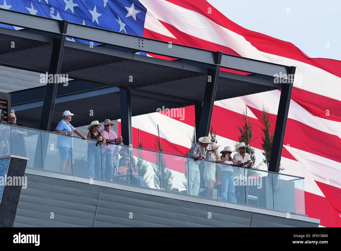 Fans in a suite watch during qualifying for the Formula One United ...