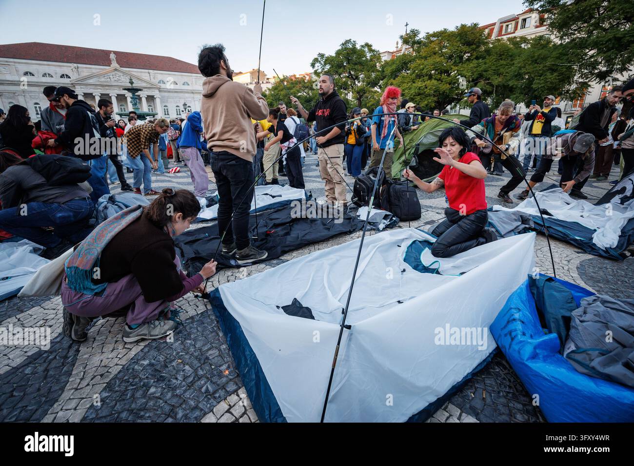 Lisbon, Portugal. 24th Oct, 2026. Protesters set up a tent in Rossio ...