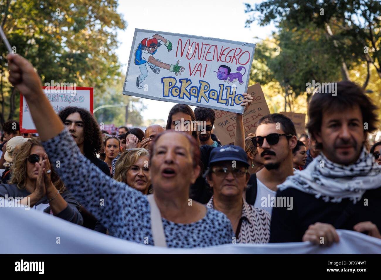 Lisbon, Portugal. 24th Oct, 2026. A protester holds a placard during ...