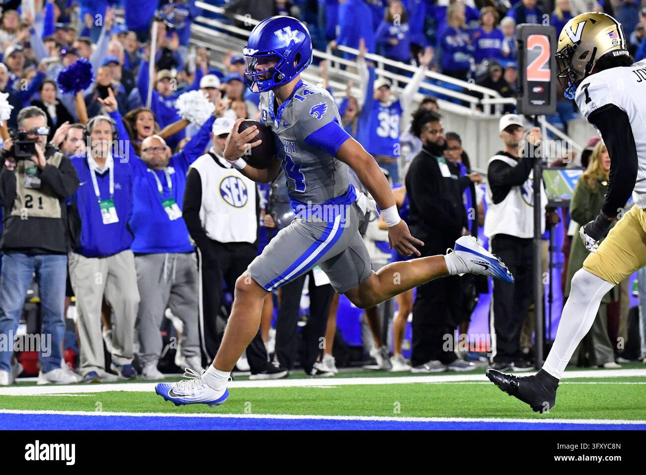 Kentucky quarterback Brennen Ward (14) crosses the goal line to score ...
