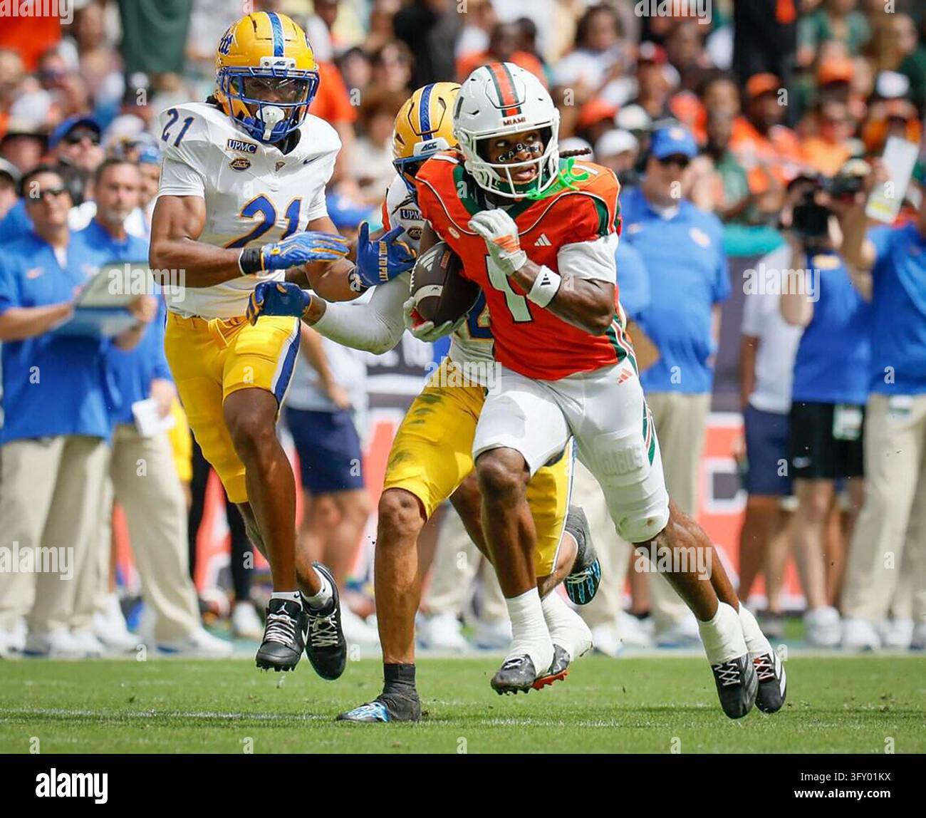 Miami Hurricanes wide receiver Malachi Toney (1) carries the ball while ...