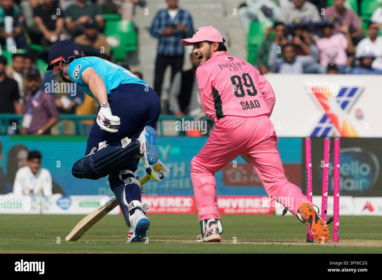 Brook Vector England's Harry Brook, left, is run out by Pakistan's Saad Baig during ...