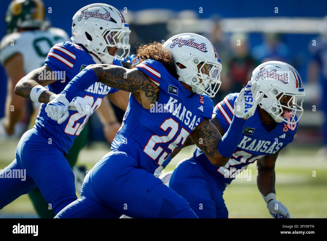 Kansas safety Christian Pritchett, left, linebacker Jibreel al-Amin ...