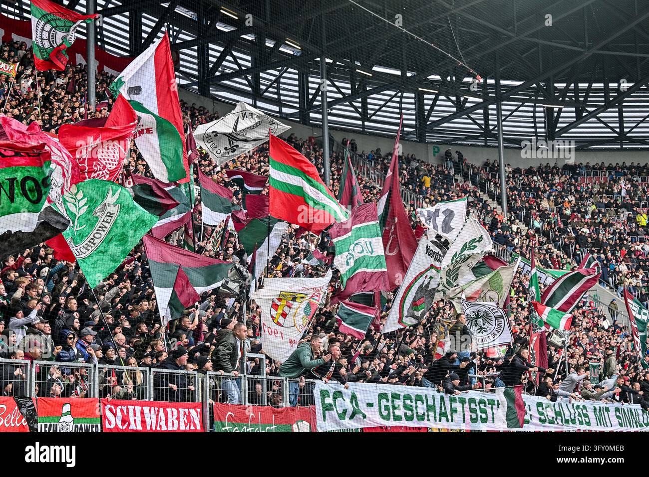 Augsburg fans [supporters] waving flags, fans [supporters], ultras, fan ...