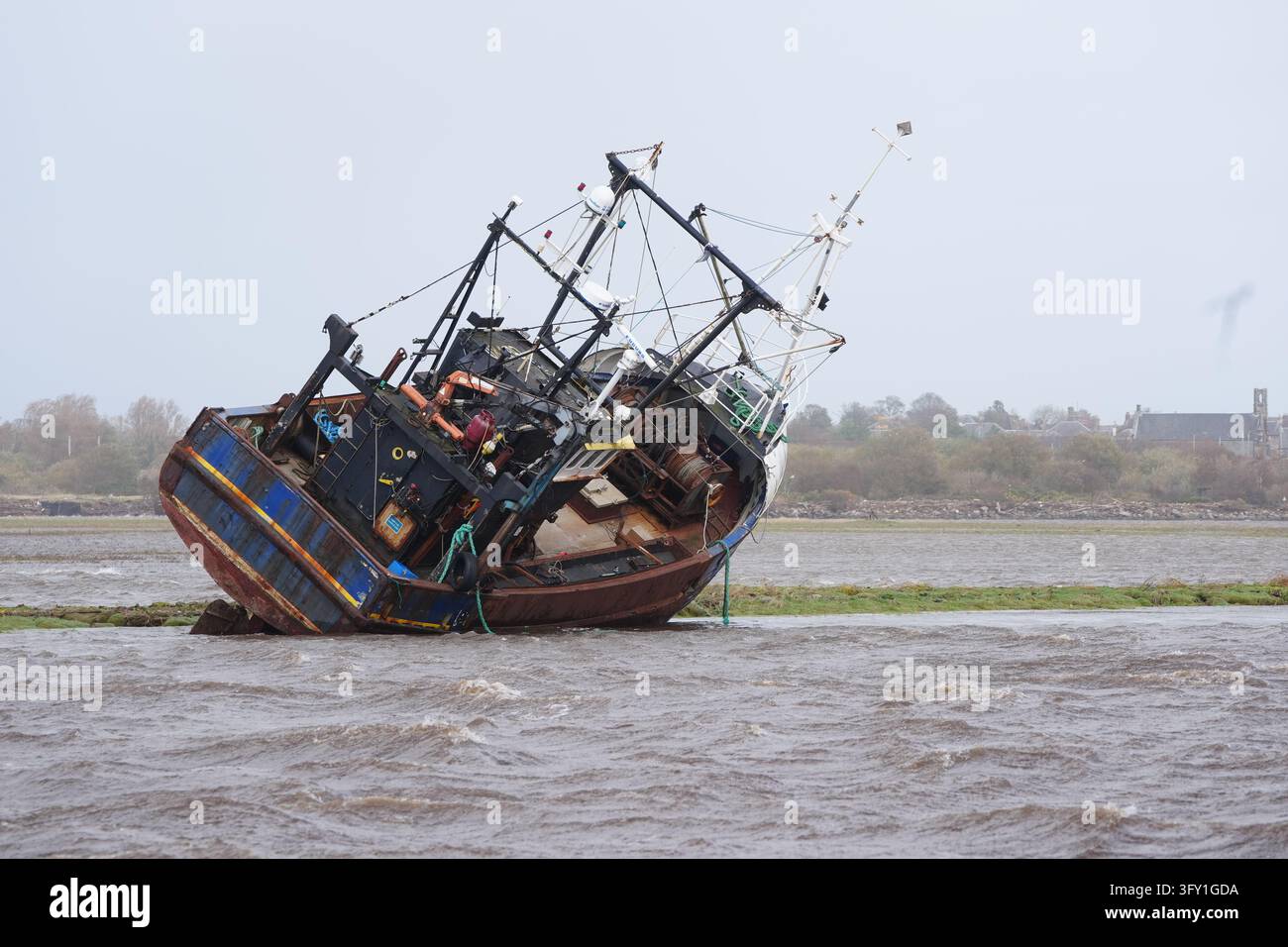 A fishing boat is stranded at Irvine Harbour in Ayrshire after coming ...