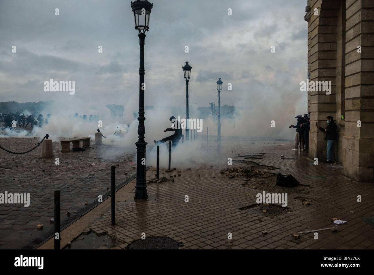 Clashes During The Yellow Vests Protest - Act II - A demonstrator kicks ...