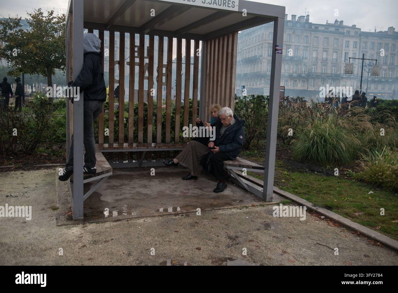 Clashes During The Yellow Vests Protest - Act II - Two people sit under ...