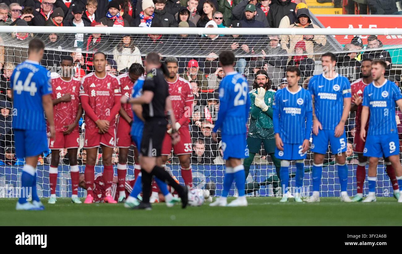 Liverpool goalkeeper Alisson Becker lines up his wall during the ...