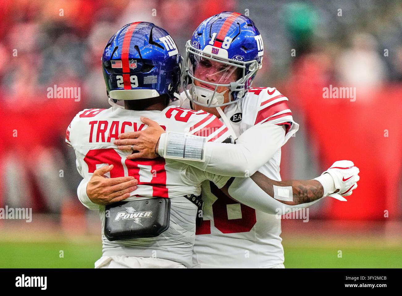 Team Hug Vector New York Giants quarterback J.J. McCarthy (18) and New York Giants ...