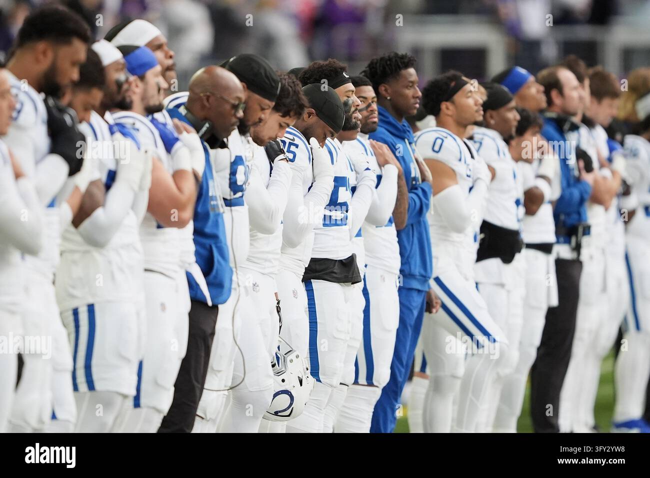 Indianapolis Colts players stand during the national anthem before an ...