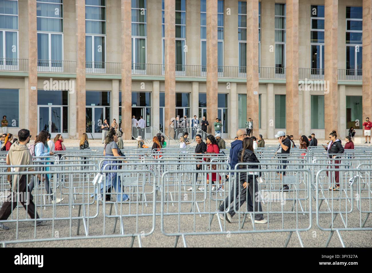 Lisbon, Portugal. 25 October 2026. People walk through lanes formed by ...