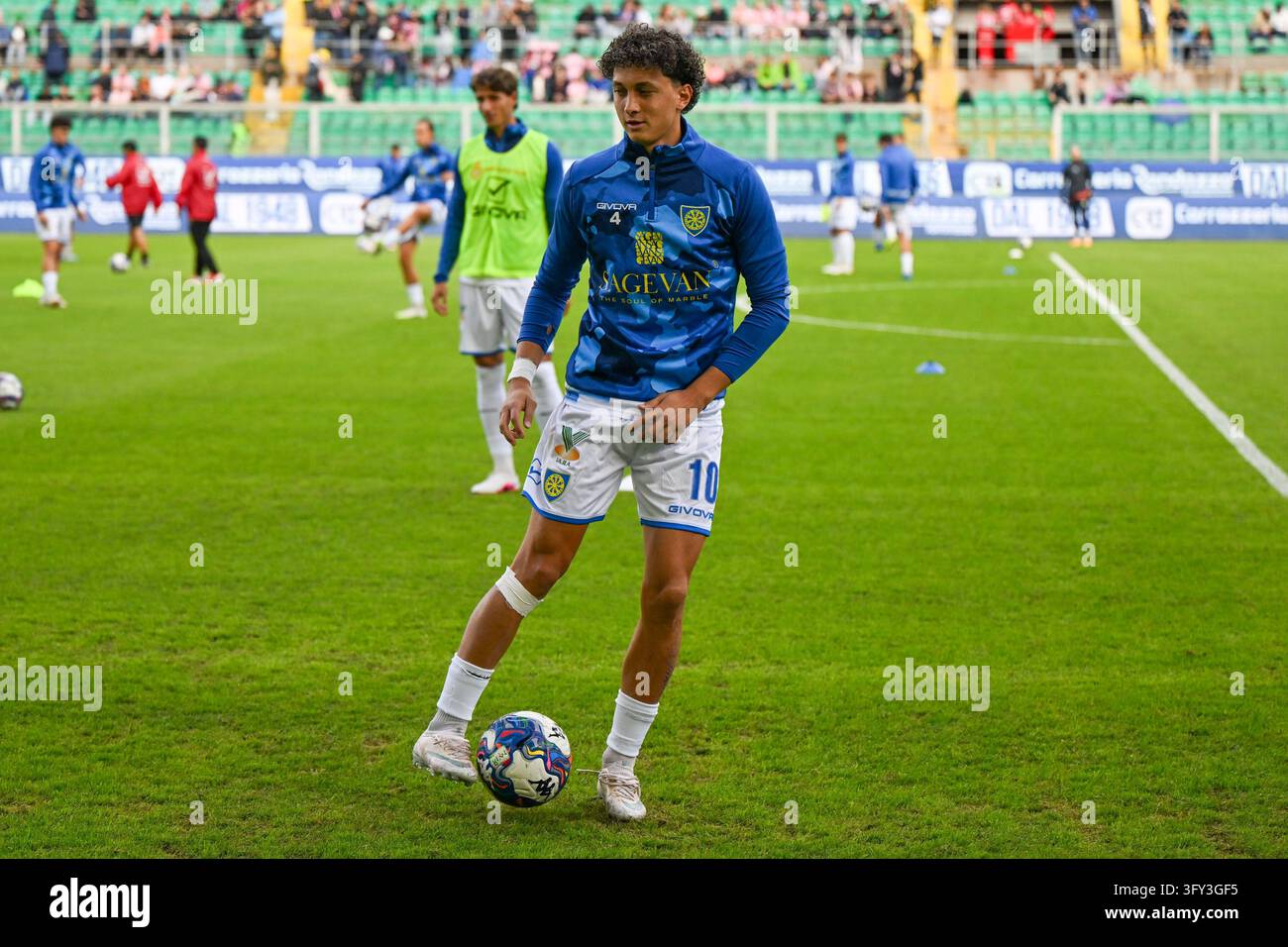 IPA90178047 - Tommaso Rubino (Carrarese Calcio 1908) warms up during ...