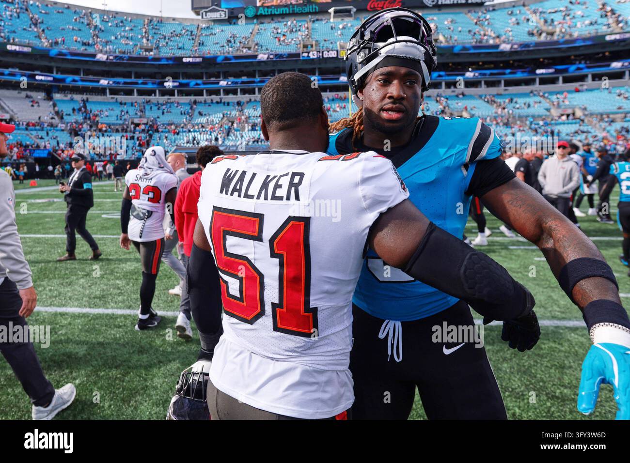 Team Hug Vector Tampa Bay Buccaneers' David Walker (51) hugs Carolina Panthers ...