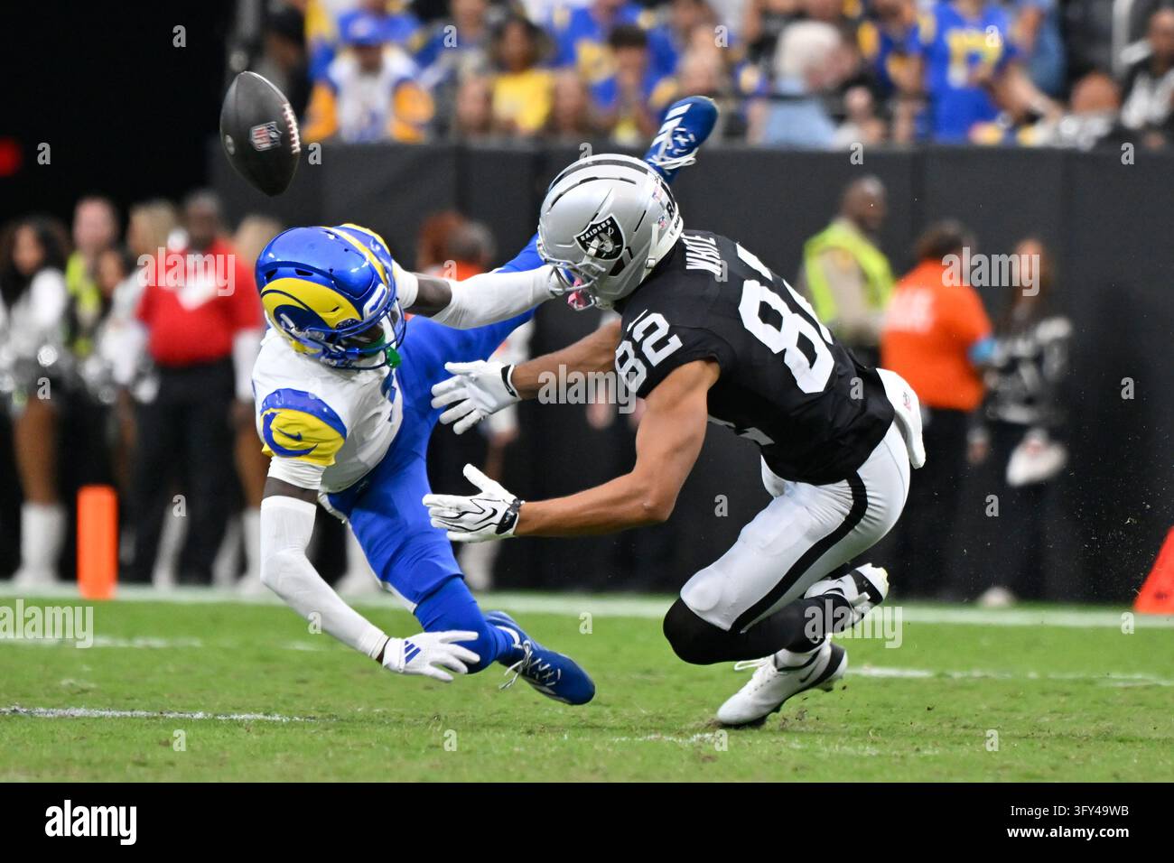 Los Angeles Rams cornerback Emmanuel Forbes, left, disrupts a pass ...