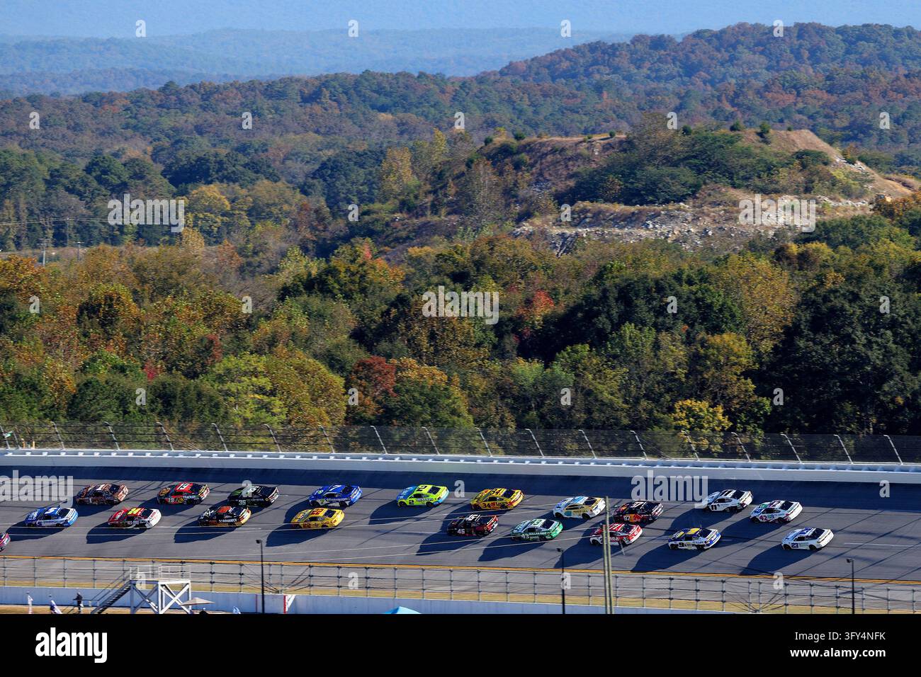 LINCOLN, AL - OCTOBER 25: The cars race through Turn 1 during the ...