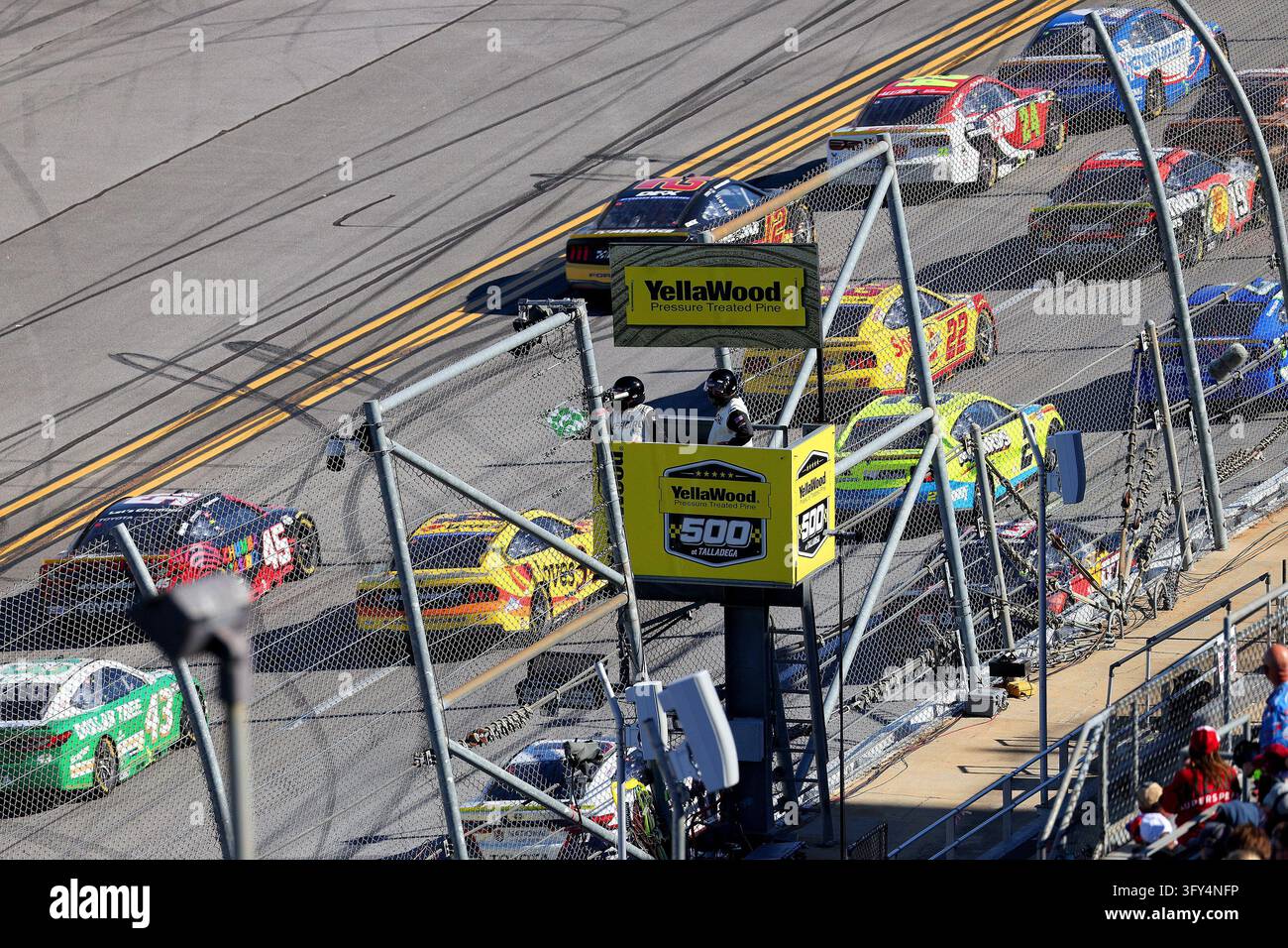 LINCOLN, AL - OCTOBER 25: The NASCAR Official waves the green and white ...