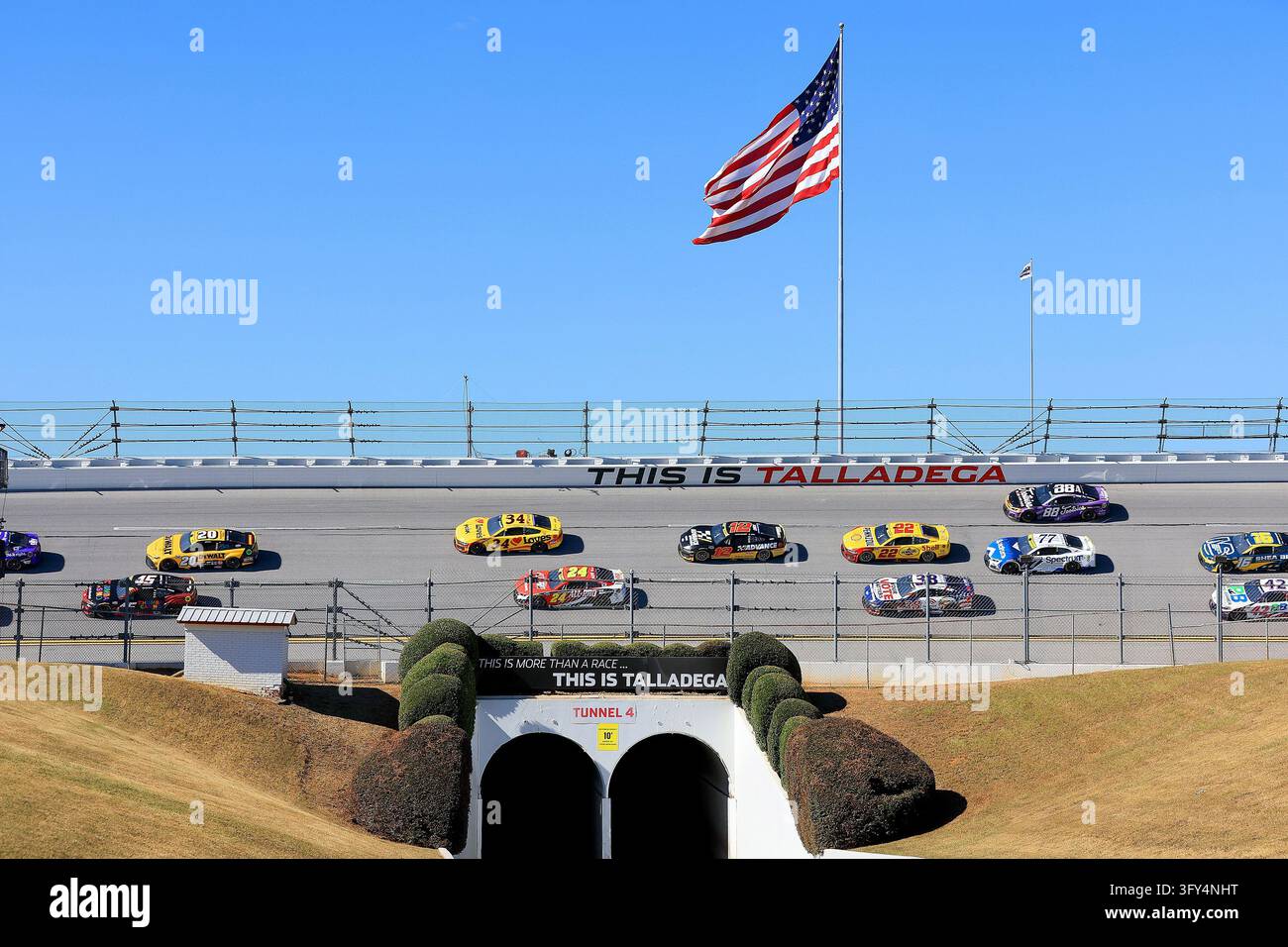 LINCOLN, AL - OCTOBER 25: The cars race over the Turn 4 tunnel during ...
