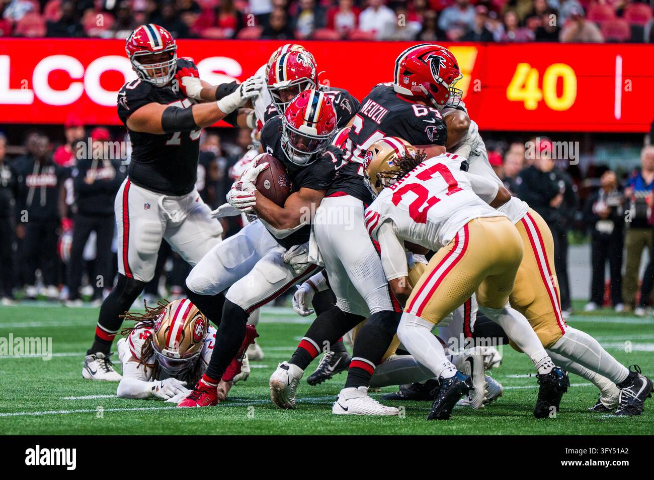 Football Block Image Vector Atlanta Falcons running back Bijan Robinson (7) runs the ball as center ...