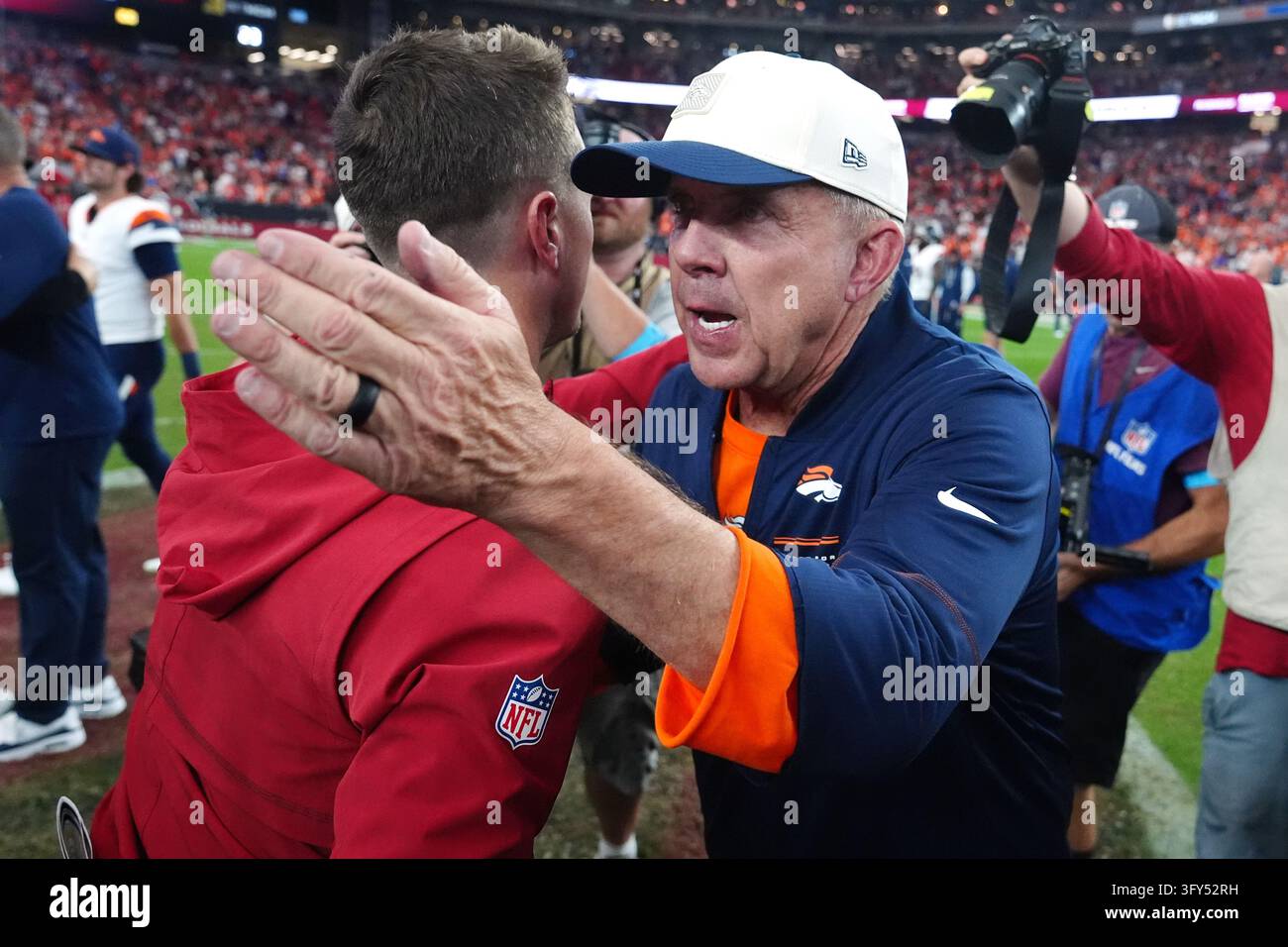 Team Hug Vector Denver Broncos head coach Sean Payton hugs Arizona Cardinals head coach ...