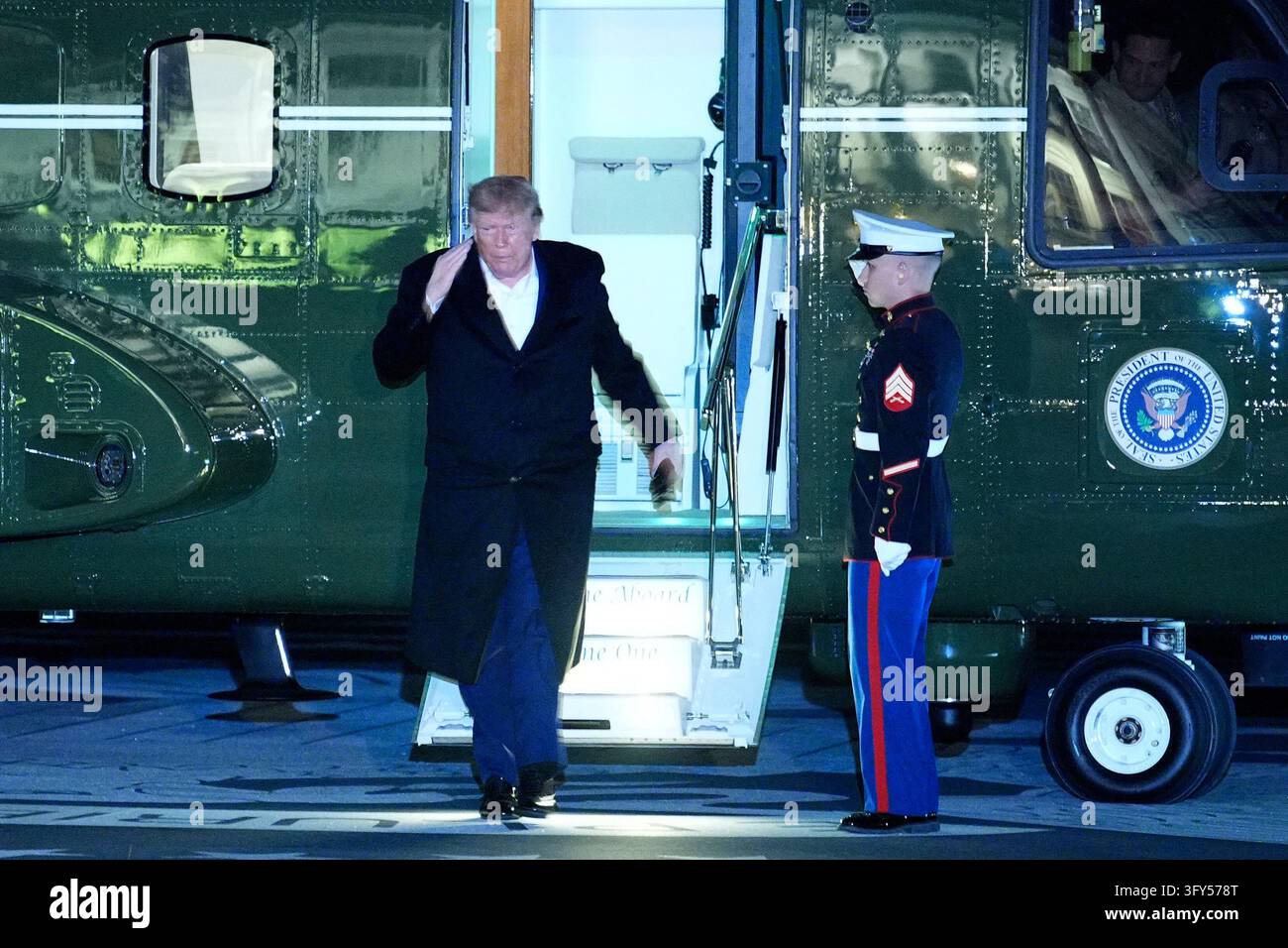 Washington Rally US President Donald Trump salutes as he disembarks Marine One ...