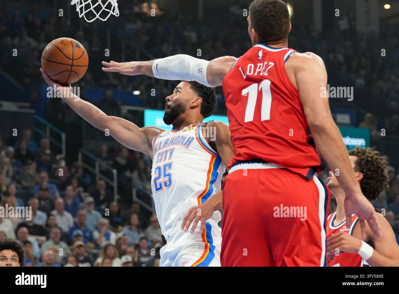 Oklahoma City Thunder guard Ajay Mitchell (25) looks to shoot in front ...