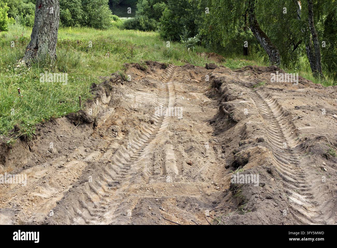 Excavated soil foundation for a new park walking path with visible ...