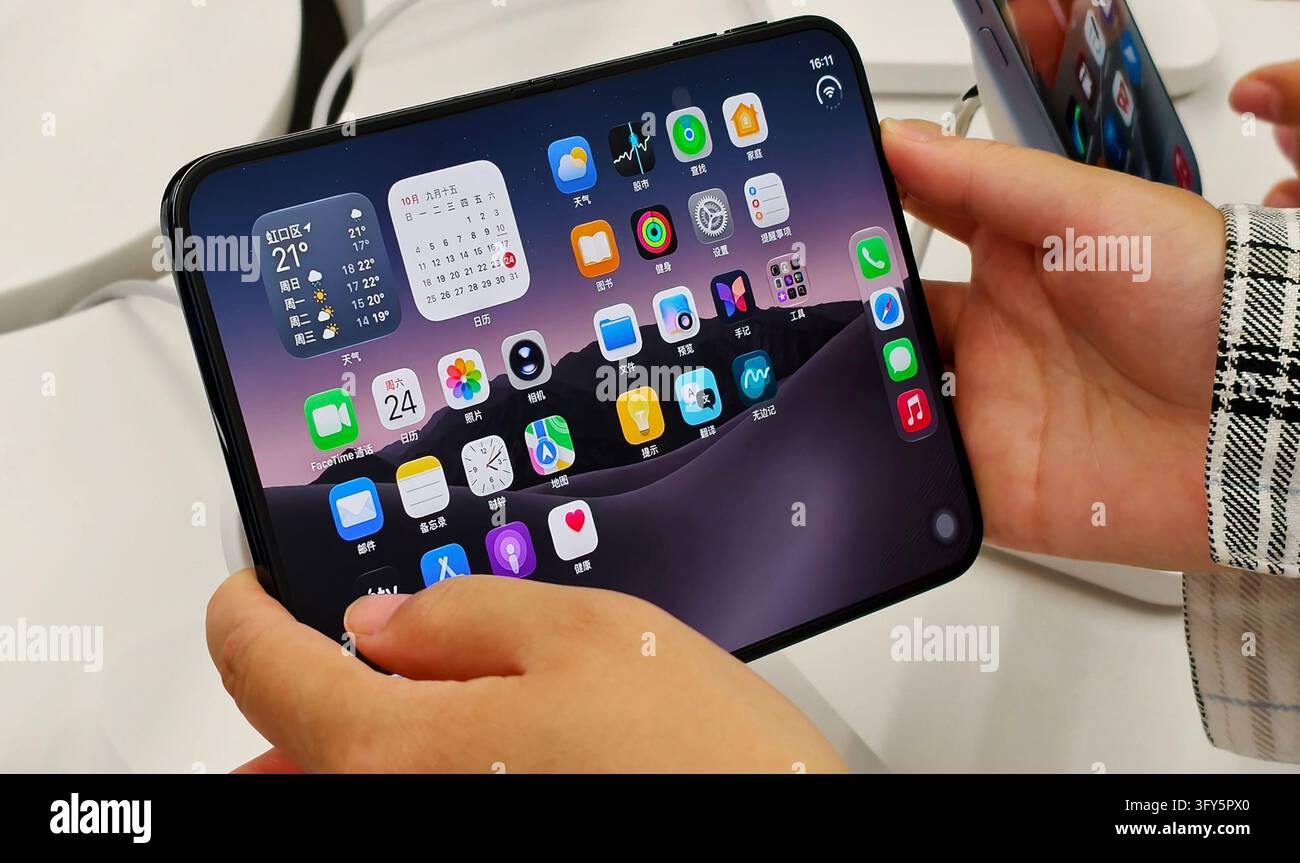 SHANGHAI, CHINA - OCTOBER 24, 2026 - A consumer is experiencing Apple's ...