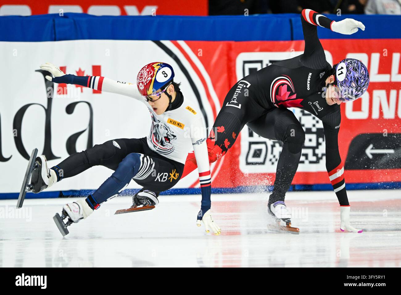 VANCOUVER, CAN - OCTOBER 25: Jongun Rim of South Korea, Felix Roussel ...