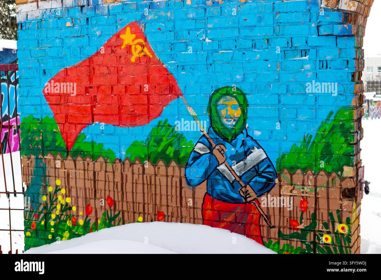 Patriotic graffiti featuring a grandmother holding a red Soviet flag ...