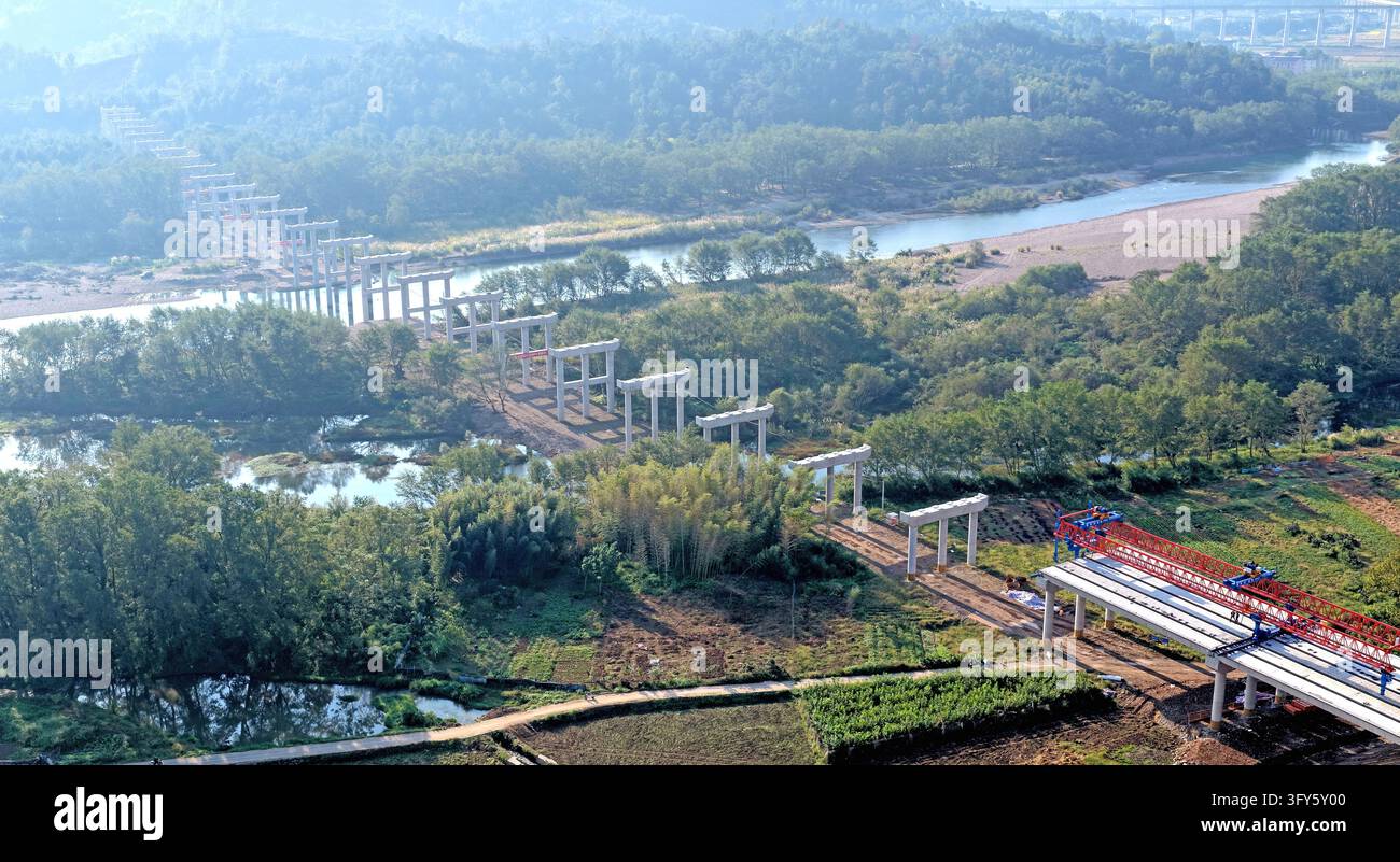 Of Users Builders use a large bridge-erecting machine to install girders at the ...