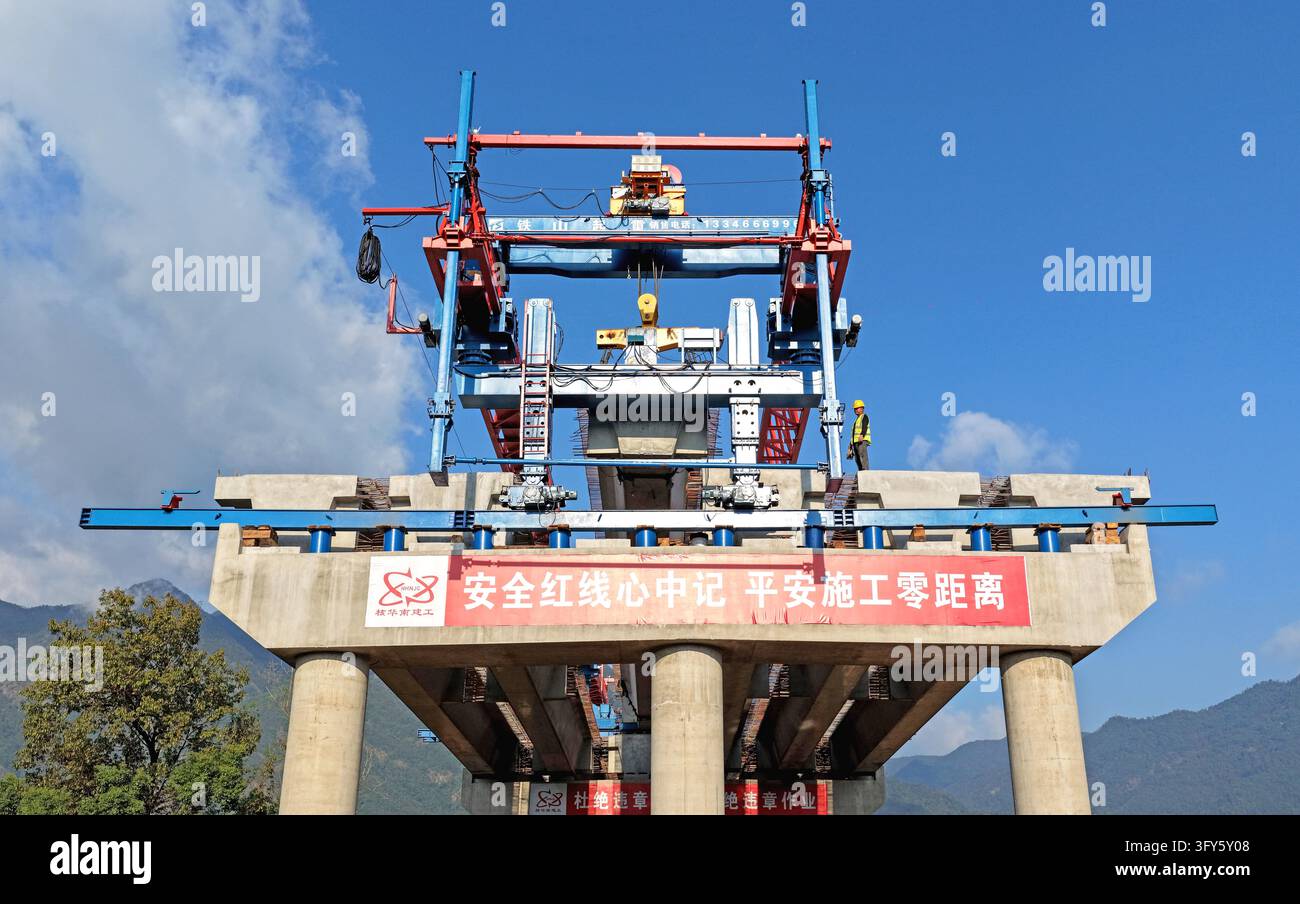 Of Users Builders use a large bridge-erecting machine to install girders at the ...