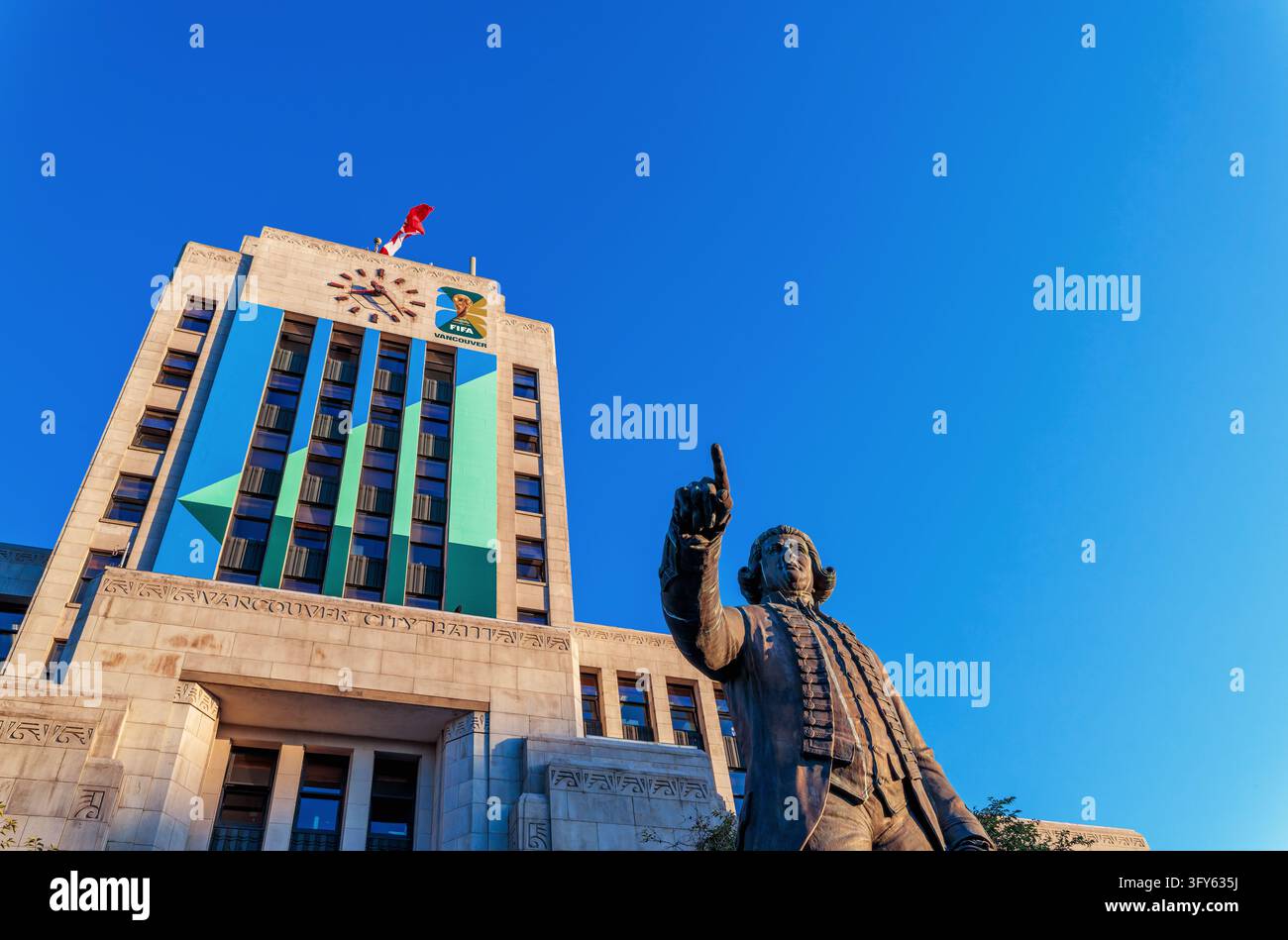 The historic Vancouver City Hall building with Canadian flag and ...