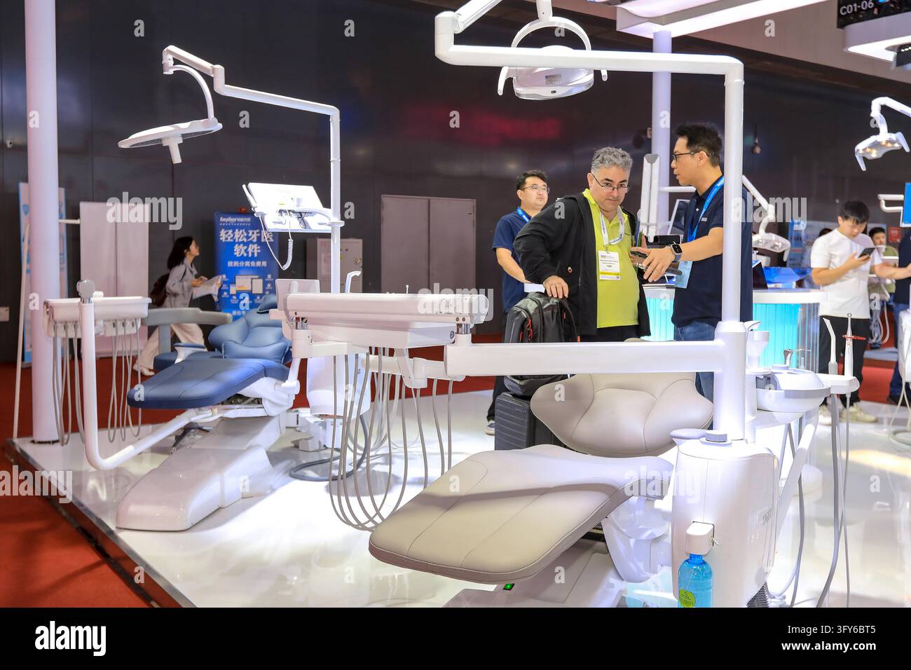 Comp Learning Foreign buyers learn about dental chairs at the SIG Medical booth ...