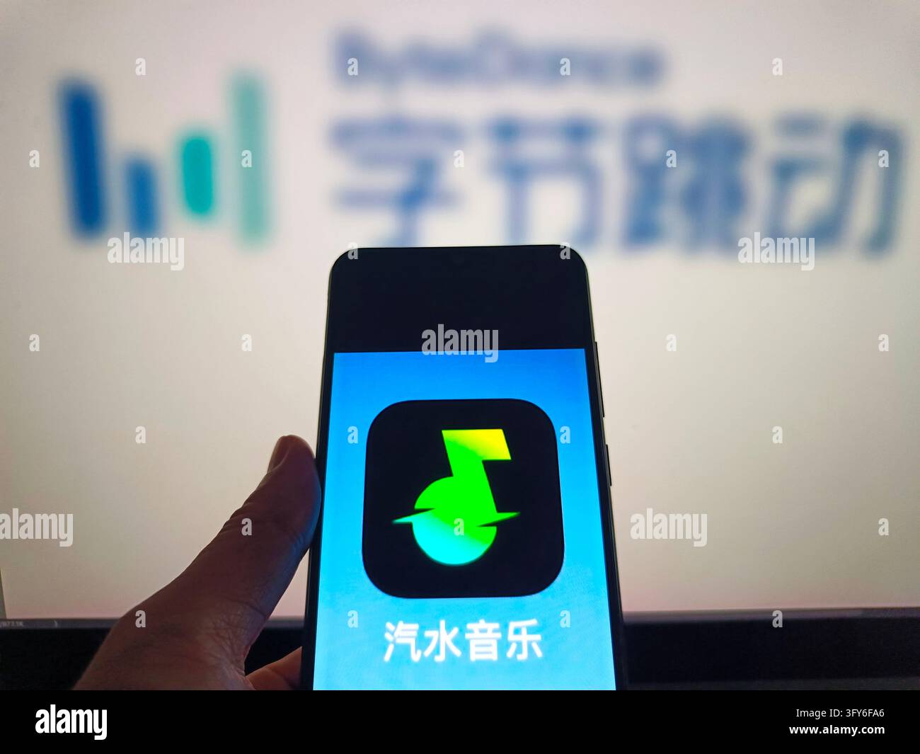 SUQIAN, CHINA - OCTOBER 26, 2026 - A netizen is using his mobilephone ...