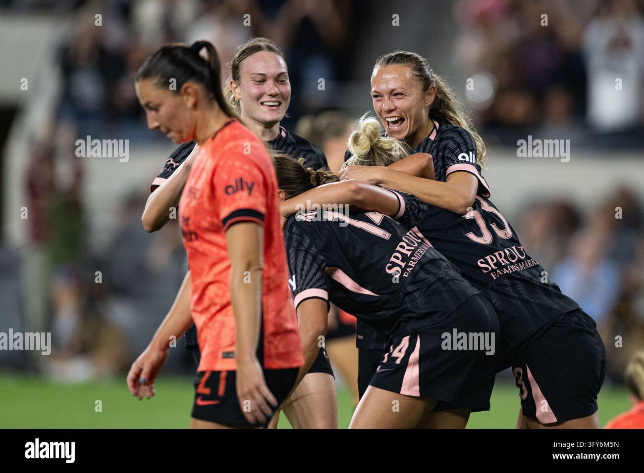 Team Hug Vector Angel City FC forward Claire Emslie (10) hugs Angel City FC forward ...