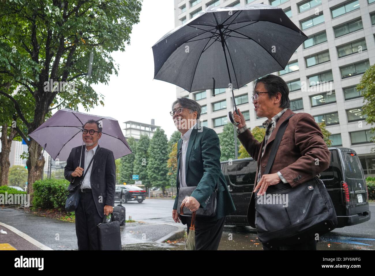 Japanese manga artist Yoshinori Kobayashi, center, who has written ...
