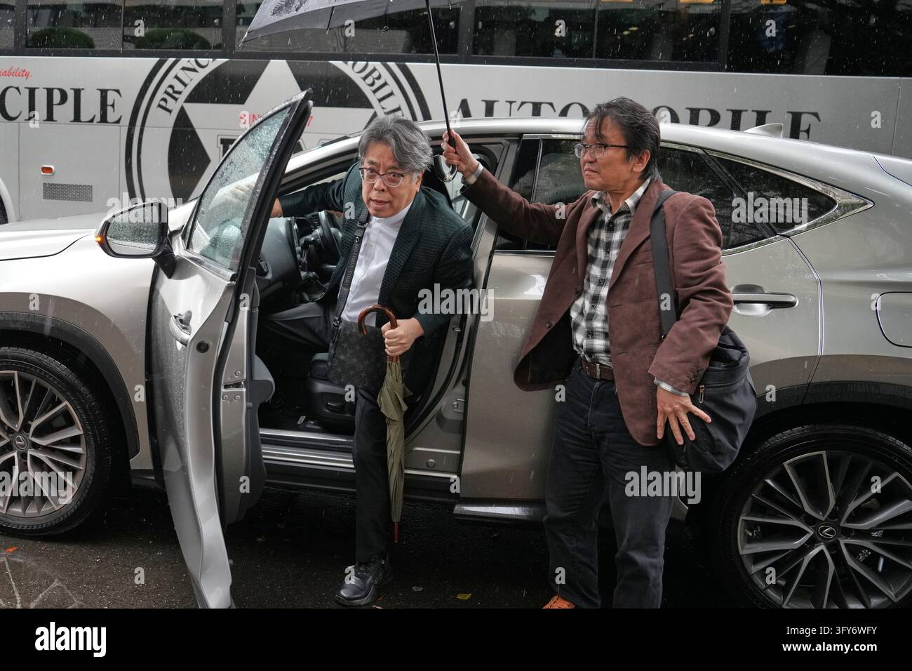 Japanese manga artist Yoshinori Kobayashi, center, who has written ...
