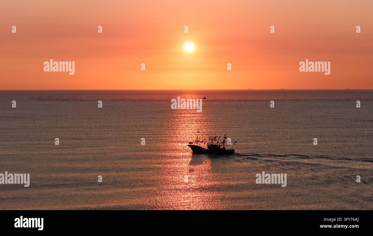 Fish Worker Workers sail fishing boats at sunrise to tend oyster farms and replace ...