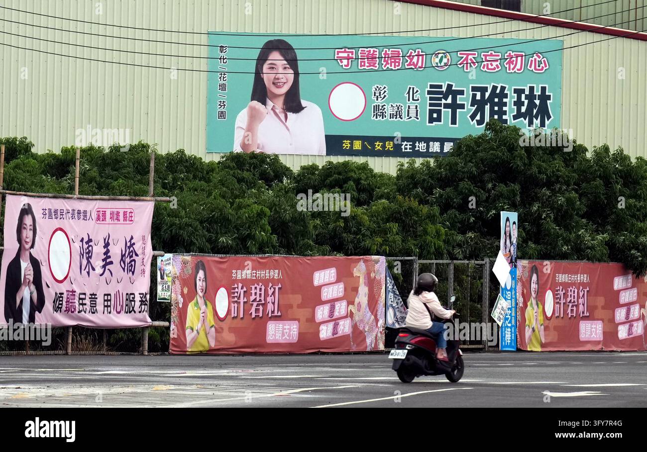 Campaign posters are seen in the city of Changhua County on October 24 ...