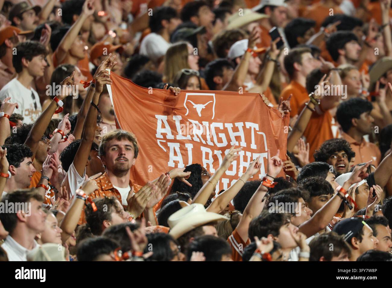 AUSTIN, TX - OCTOBER 24: Texas students hold up an Alright, Alright ...