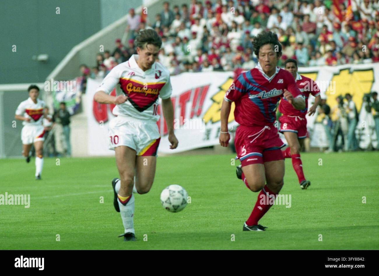 Nagoya Grampus forward Gary Lineker, left, dribbles the ball whilst ...