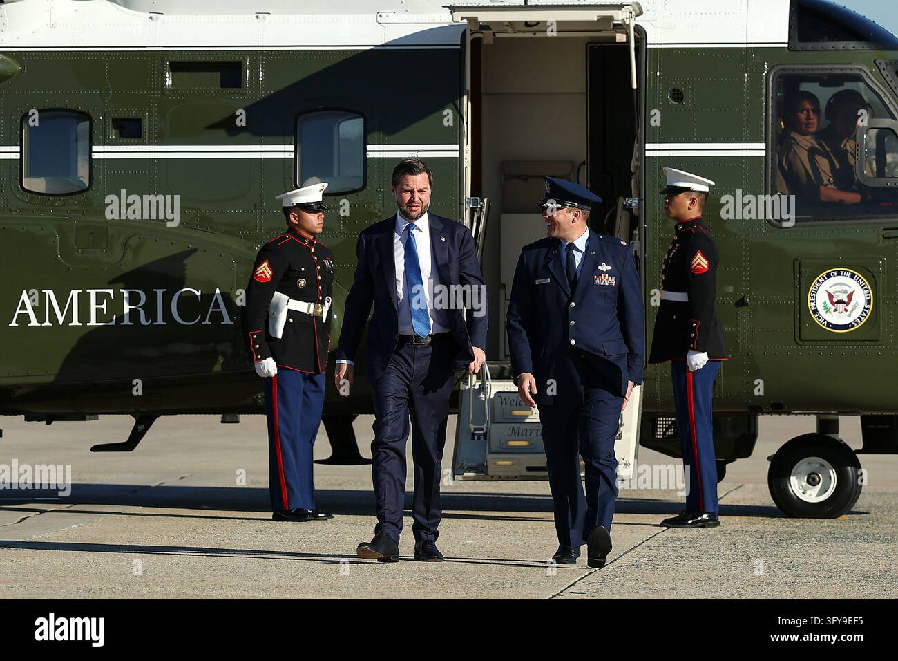 For President Vector Vice President JD Vance, center left, walks from Marine Two to board ...
