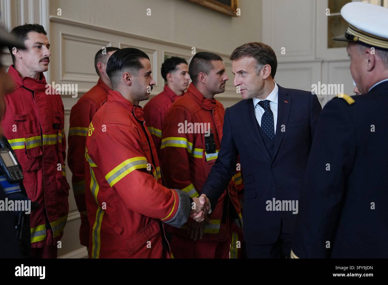 French President Emmanuel Macron meets with firefighters at the city ...