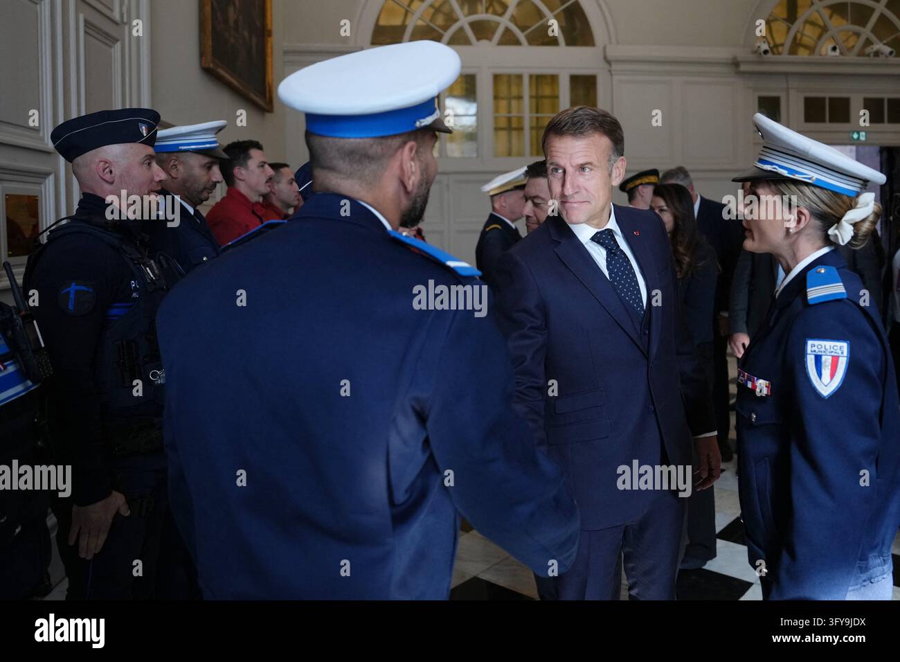 French President Emmanuel Macron meets with police officers at the city ...